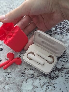 Sleek Red and White Wireless Earbuds with Charging Case